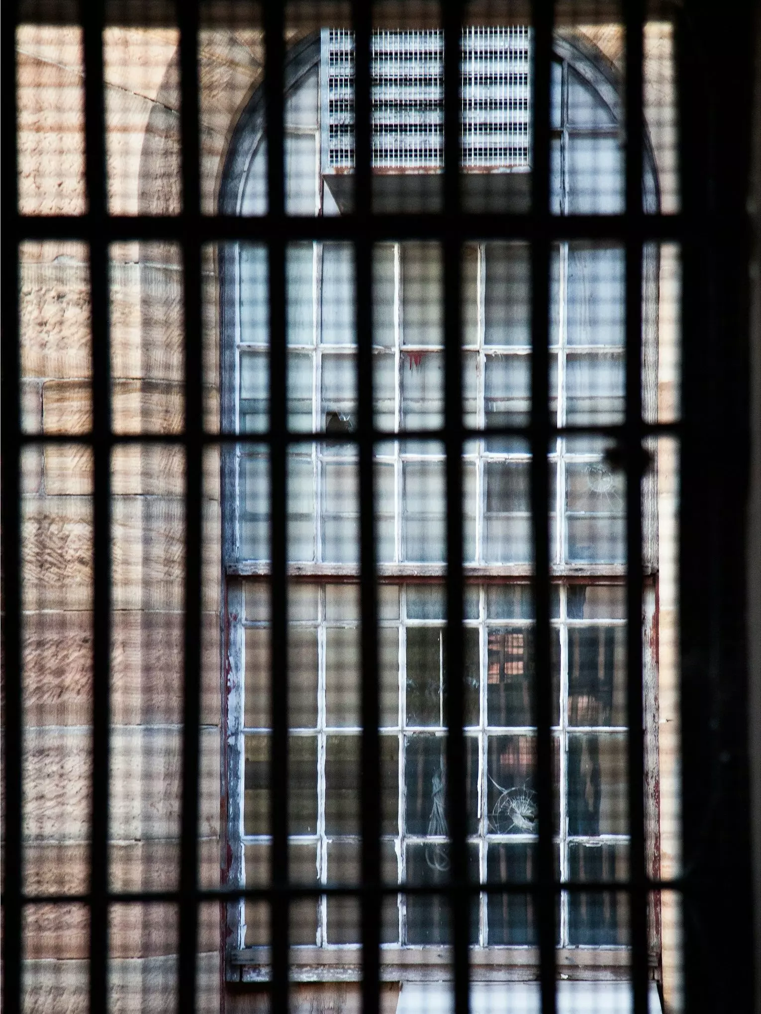 image looking out from behind bars